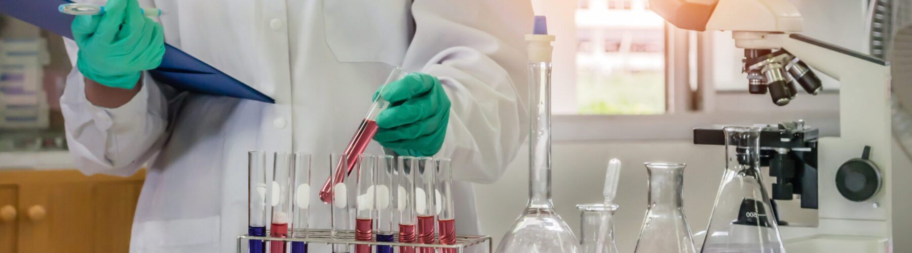 scientist with equipment and science experiments in laboratory